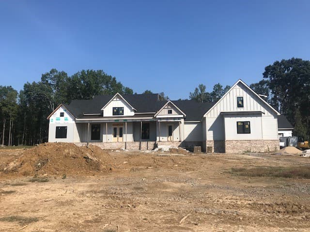 Farmhouse style home with new vinyl siding