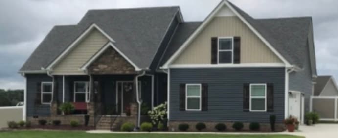Home with vinyl siding and Board and Batten accents