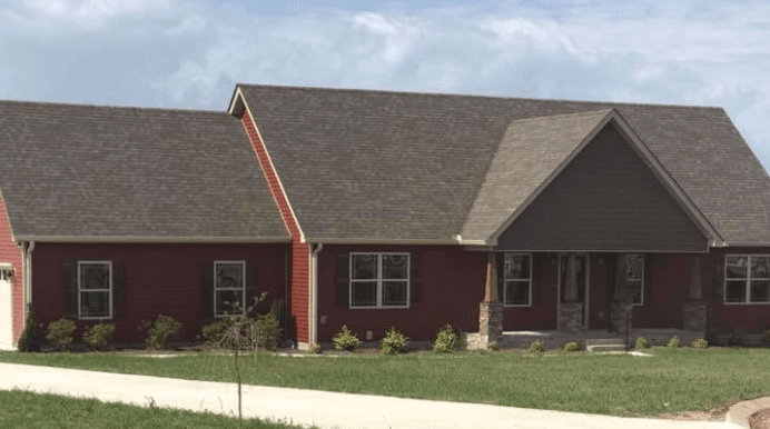 Home with Redwood vinyl siding and shake accents